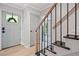 Entryway featuring wood staircase and view of the front door at 3306 Emory Dr, Marietta, GA 30062