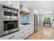 Well-equipped kitchen with stainless steel appliances, stylish backsplash, and ample cabinet space at 3306 Emory Dr, Marietta, GA 30062