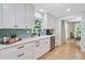 Bright kitchen featuring white cabinets, stainless steel appliances, and a window over the sink at 3306 Emory Dr, Marietta, GA 30062