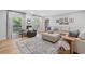 Bright living room with large windows, light wood floors, neutral decor, and comfortable seating at 3306 Emory Dr, Marietta, GA 30062