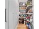 Custom pantry shelving in a walk-in pantry with pull-out baskets and lazy-susan shelves at 3306 Emory Dr, Marietta, GA 30062