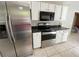 Modern kitchen equipped with stainless steel appliances and ample counter space at 50 Glenmore Dr, Kingston, GA 30145