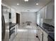 Open kitchen featuring white cabinetry, stainless steel appliances, and natural light at 50 Glenmore Dr, Kingston, GA 30145