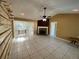 Bright living area with tile floors, fireplace, and access to a sunroom at 50 Glenmore Dr, Kingston, GA 30145