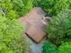 Aerial view of the roof of the property nestled among many tall and lush trees at 5800 Mitchell Rd, Atlanta, GA 30328