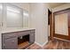 Bathroom featuring a vanity with drawers and cabinets below, and a door with curtain at 5800 Mitchell Rd, Atlanta, GA 30328