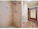 Tiled shower stall in bathroom with modern fixtures and wood look flooring at 5800 Mitchell Rd, Atlanta, GA 30328