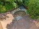 View from above showing the roofline of the house and a dry, empty pool at 5800 Mitchell Rd, Atlanta, GA 30328