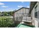 A cozy balcony featuring an outdoor sofa with tree-lined views, perfect for relaxation at 6851 Roswell Rd # K-23, Atlanta, GA 30328