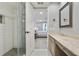 Bright bathroom featuring a glass shower, marble countertops, and open doorway to the bedroom at 6851 Roswell Rd # K-23, Atlanta, GA 30328