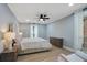 Light and airy bedroom featuring a comfortable bed, neutral tones, and large windows for ample natural light at 6851 Roswell Rd # K-23, Atlanta, GA 30328