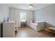 Cozy bedroom with a unicorn themed decor and a window providing natural light at 6851 Roswell Rd # K-23, Atlanta, GA 30328