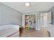 Light bedroom with a colorful closet including built-in shelving for easy organization at 6851 Roswell Rd # K-23, Atlanta, GA 30328