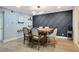 Spacious dining room featuring stylish decor, modern lighting and an adjacent serving space at 6851 Roswell Rd # K-23, Atlanta, GA 30328
