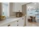 Bright kitchen featuring white cabinets, quartz countertop, and modern appliances at 6851 Roswell Rd # K-23, Atlanta, GA 30328