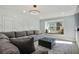 Inviting living room with decorative wall paneling, and modern recessed lighting at 6851 Roswell Rd # K-23, Atlanta, GA 30328
