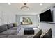 Stylish living room featuring modern lighting, a window seat, and a sleek TV setup at 6851 Roswell Rd # K-23, Atlanta, GA 30328