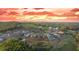 Sunset aerial view of a residential community on a hill with winding roads and expansive mountain views at 237 Laurel Vista Dr, Canton, GA 30114
