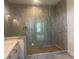 This luxurious primary bath features elegant tile and glass shower with built in bench at 237 Laurel Vista Dr, Canton, GA 30114