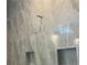 This luxurious shower features elegant tile and custom niche for storage at 237 Laurel Vista Dr, Canton, GA 30114