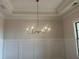 Elegant dining room features a tray ceiling and decorative wainscoting at 237 Laurel Vista Dr, Canton, GA 30114