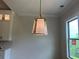 Dining room showcasing a stylish pendant light fixture and natural light from the window at 237 Laurel Vista Dr, Canton, GA 30114