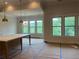 Open living area with an island and windows with serene views of nature at 237 Laurel Vista Dr, Canton, GA 30114