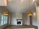 Open living room featuring modern pendant lights, brick fireplace, and large windows at 237 Laurel Vista Dr, Canton, GA 30114