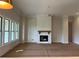 Bright living room featuring a white brick fireplace and large windows at 237 Laurel Vista Dr, Canton, GA 30114