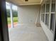 Spacious covered patio with concrete flooring and natural light, perfect for outdoor living at 237 Laurel Vista Dr, Canton, GA 30114