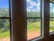 Bright windows offer serene views of the lush greenery surrounding this beautiful property at 237 Laurel Vista Dr, Canton, GA 30114