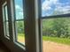 Bright windows offer serene views of the lush greenery surrounding this beautiful property at 237 Laurel Vista Dr, Canton, GA 30114