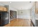 Dining area with wood floors and views of staircase at 5221 Sherwood Way, Cumming, GA 30040