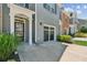 Charming townhome with a well-manicured lawn and attached garage at 5221 Sherwood Way, Cumming, GA 30040