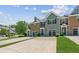Charming townhome with a well-manicured lawn and attached garage at 5221 Sherwood Way, Cumming, GA 30040