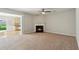 Cozy living room with a fireplace and neutral carpet at 5221 Sherwood Way, Cumming, GA 30040