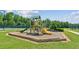 Outdoor playground surrounded by fences and lush greenery at 5221 Sherwood Way, Cumming, GA 30040