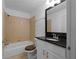 Functional bathroom featuring a shower-tub combination, granite countertop, and ample lighting at 1102 Madison Ln # 1102, Smyrna, GA 30080