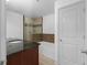 A bathroom featuring a granite-topped vanity, a tub, and a tiled shower at 1102 Madison Ln # 1102, Smyrna, GA 30080
