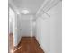 A walk-in closet featuring hardwood floors, white walls, a light, and wire shelving at 1102 Madison Ln # 1102, Smyrna, GA 30080