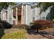 View of the condo's exterior showcasing the building's architectural details and landscaping at 1102 Madison Ln # 1102, Smyrna, GA 30080