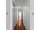 Long hallway featuring hardwood floors and neutral white walls at 1102 Madison Ln # 1102, Smyrna, GA 30080