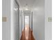 Hallway with hardwood floors and white doors at 1102 Madison Ln # 1102, Smyrna, GA 30080