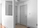 Hallway featuring neutral colors, tiled flooring, and closet and bedroom access at 1102 Madison Ln # 1102, Smyrna, GA 30080
