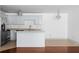 Modern kitchen with granite countertops, stainless steel appliances, and a breakfast bar at 1102 Madison Ln # 1102, Smyrna, GA 30080