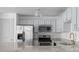 Stylish kitchen featuring stainless steel appliances, light blue cabinets, and modern fixtures at 1102 Madison Ln # 1102, Smyrna, GA 30080