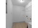 Bright laundry room features tile floor, wire shelving, and fresh white paint at 1102 Madison Ln # 1102, Smyrna, GA 30080