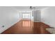 Bright and airy living room featuring hardwood floors, fresh paint, and a large window at 1102 Madison Ln # 1102, Smyrna, GA 30080