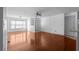 Bright and airy living room featuring hardwood floors, a ceiling fan, and large windows for natural light at 1102 Madison Ln # 1102, Smyrna, GA 30080
