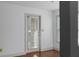 Well-lit living space with hardwood floors and a large glass door at 1102 Madison Ln # 1102, Smyrna, GA 30080